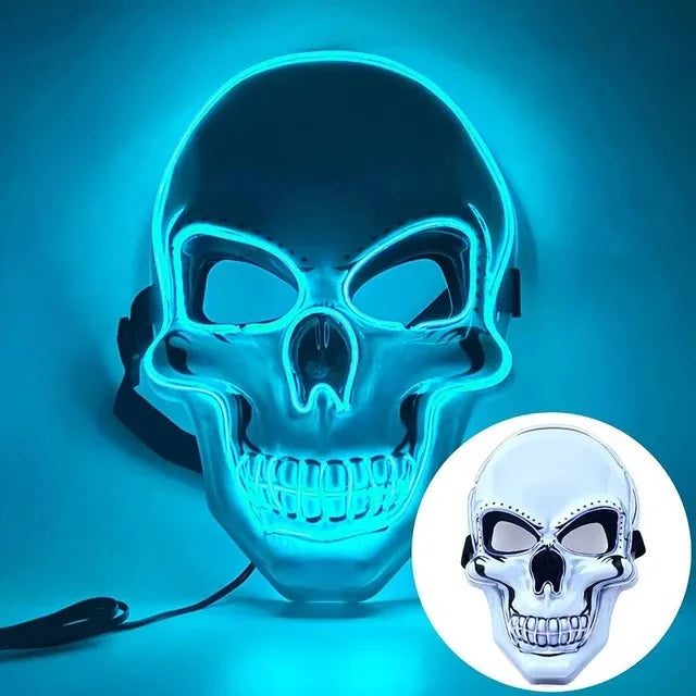 An LED glow skull mask illuminates a human skull shape with bright blue light against a dark background.
