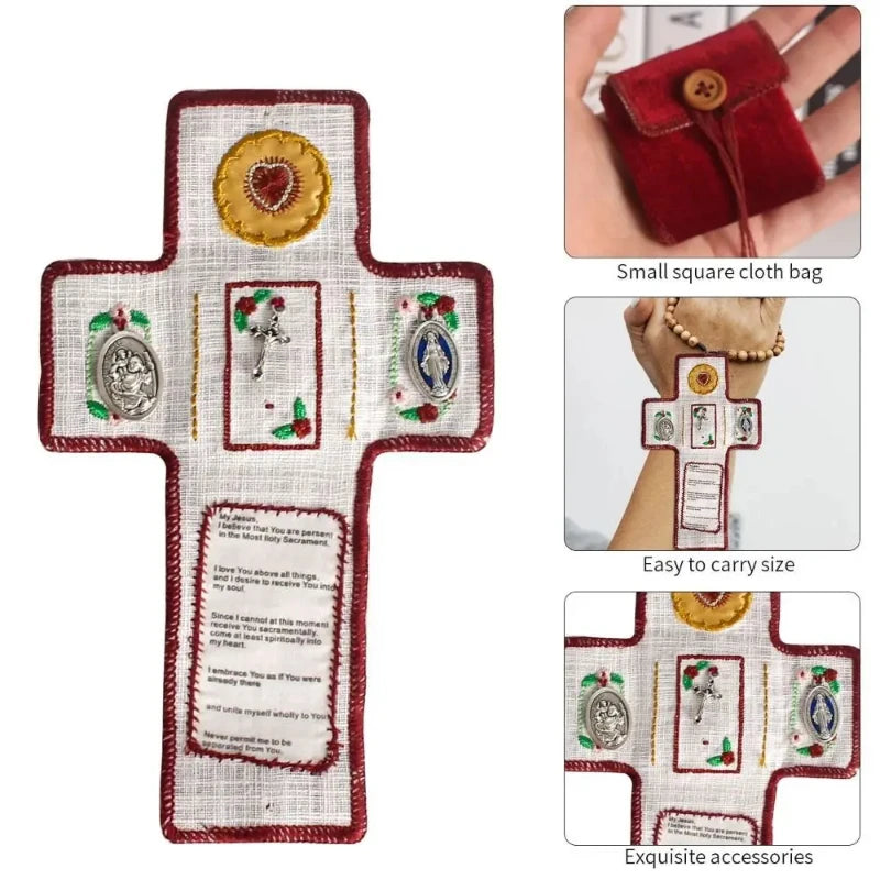 Hand sewn silver prayer cross decoration with various religious symbols on white fabric