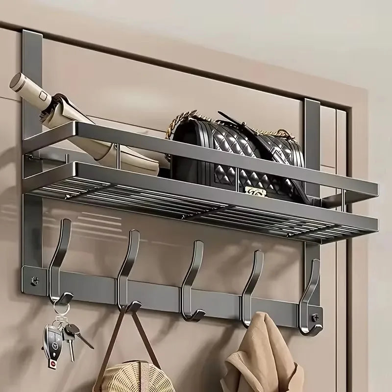 A gray over-the-door organizer rack mounted on a wall, holding a leather bag and various tools.