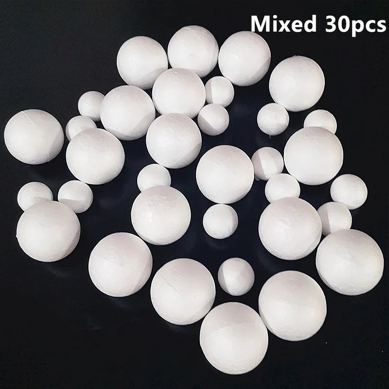 A pile of mixed white polystyrene foam balls for crafting and decorating.
