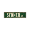 A weathered, dark green metal sign with the text STONER AVE engraved on it.