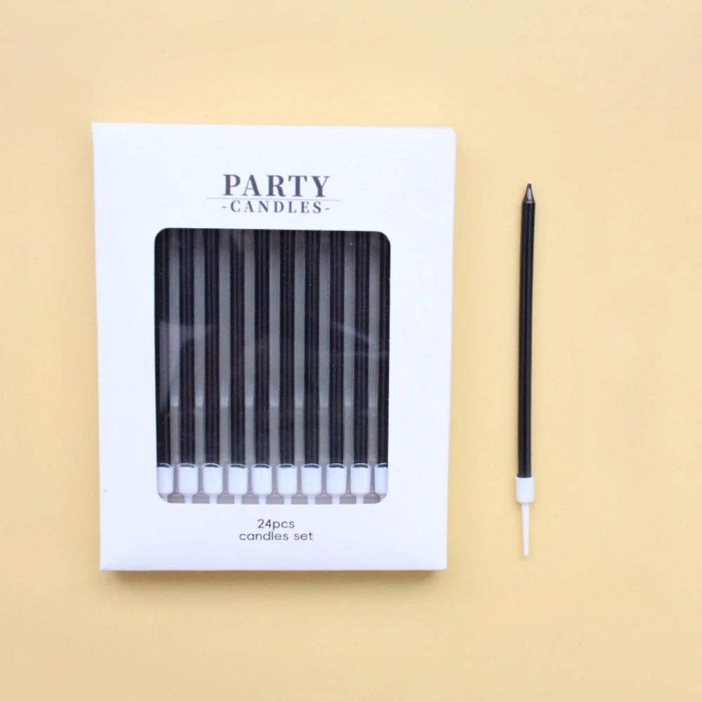 A white box labeled Party Candles containing a set of black and white candles.