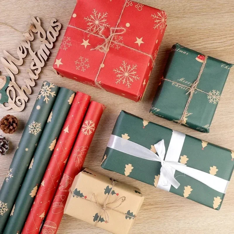 A collection of festive Christmas gift wrapping paper rolls and boxes in red, green, and gold tones on a wooden surface.