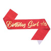 Red satin ribbon with gold text Birthday Girl and a crown design