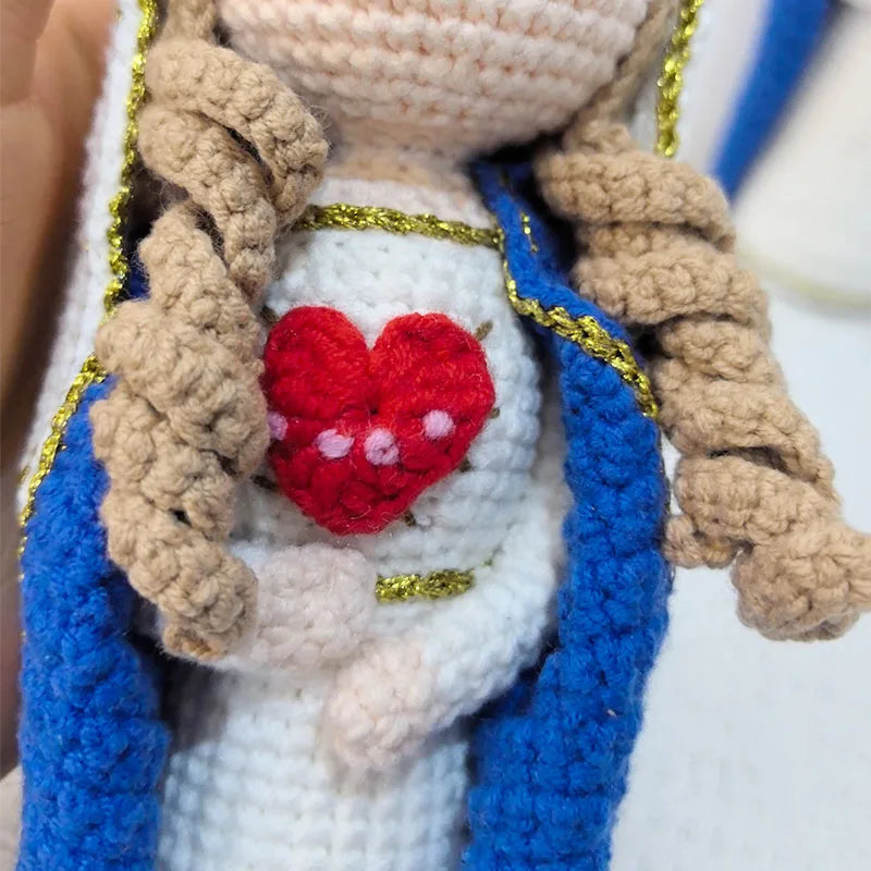 Handcrafted Virgin Mary crochet doll with brown hair and a red heart detail