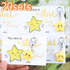 A set of 20 inspirational star keychains featuring yellow stars with smiling faces and gold accents.