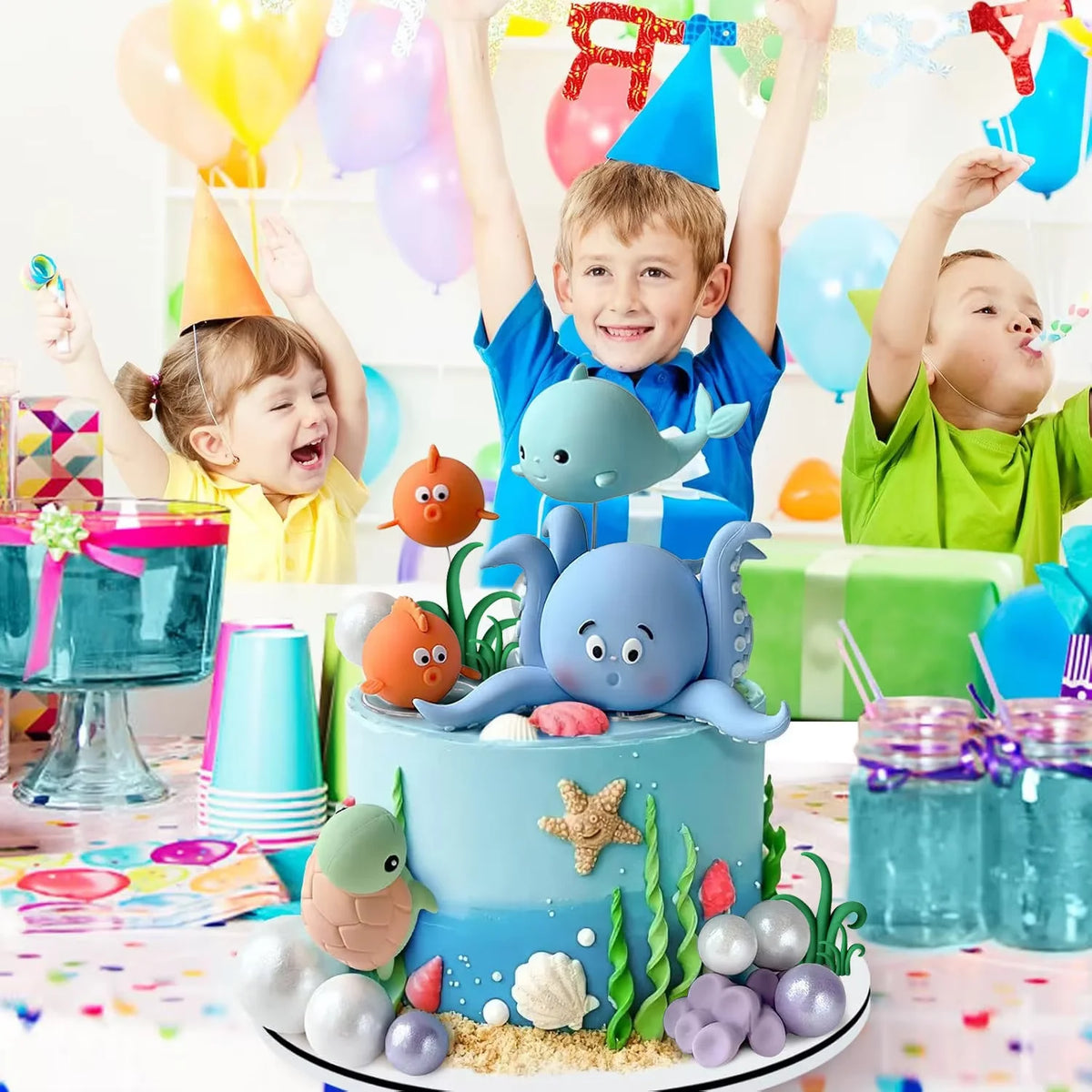 A sea-themed cake topper set featuring various ocean animals and pearl balls for parties.