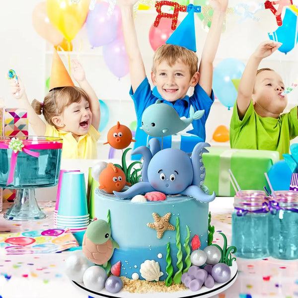 A sea-themed cake topper set featuring various ocean animals and pearl balls for parties.