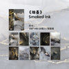 Pack of smoked ink decorative paper sheets featuring marbled black and white tones with gold accents