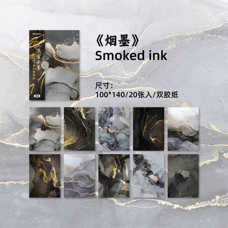 Pack of smoked ink decorative paper sheets featuring marbled black and white tones with gold accents