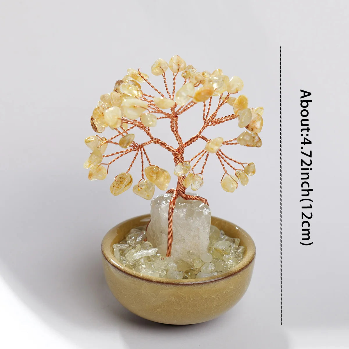 A natural crystal money tree with rose quartz base featuring delicate branches and amber-colored crystals.