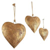 Antique golden metal heart wall decor with a rustic twine hanger