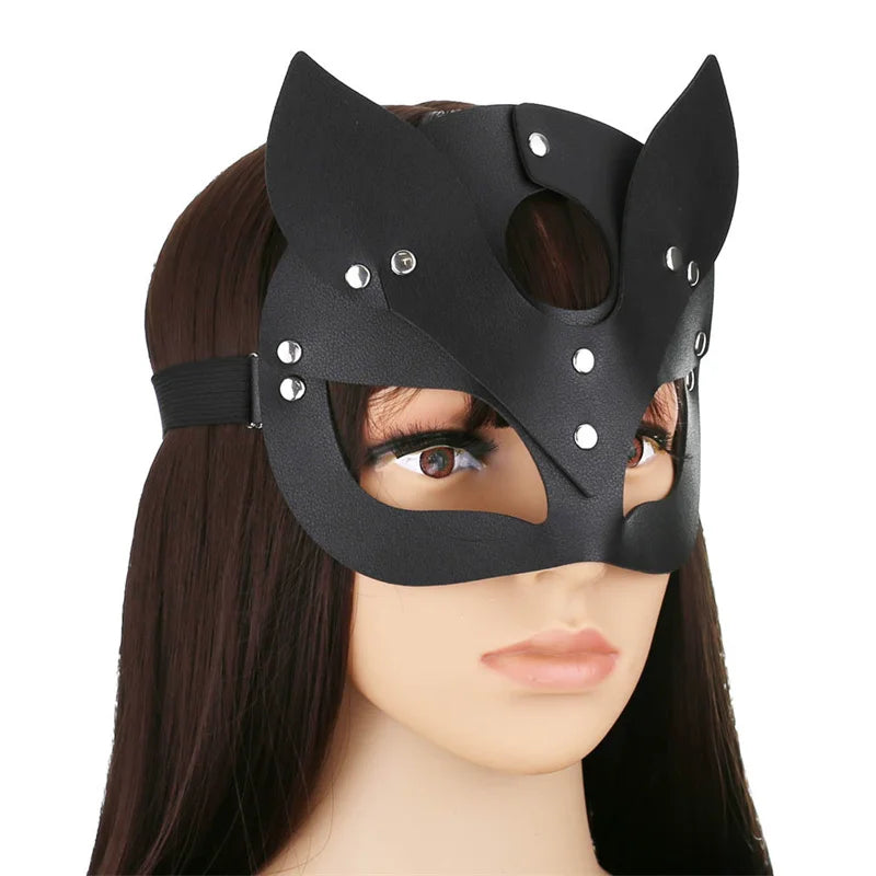 A black elegant fox masquerade mask with decorative studs shown on a mannequin head.