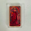 A fantasy art bar featuring a woman with fiery red hair and clothing, housed in a clear protective case.