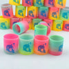 A collection of colorful silicone cups shaped like an octopus, featuring rainbow gradients in pink, yellow, and green.