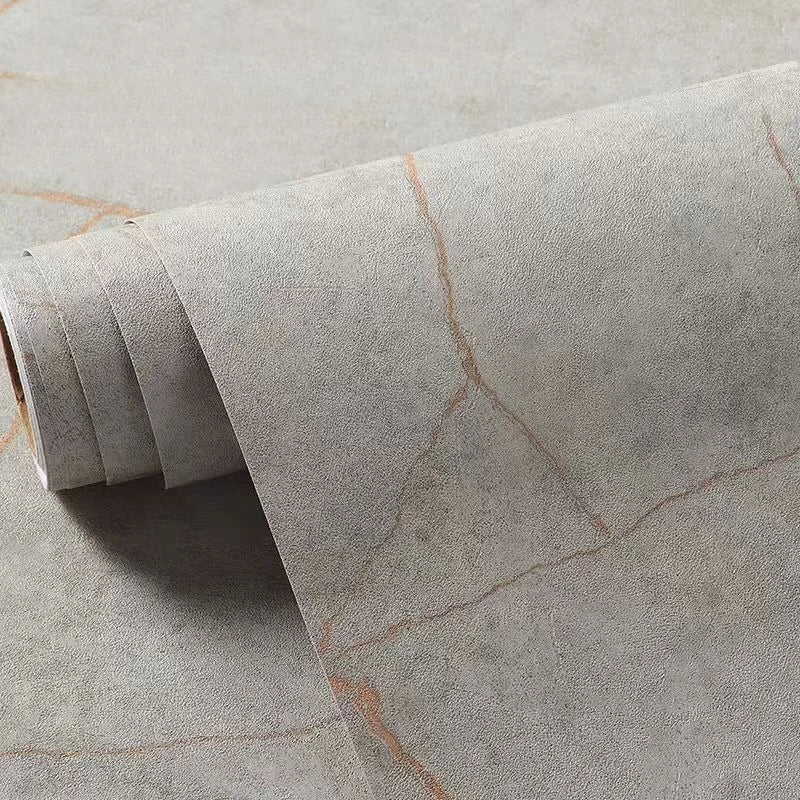 Roll of matte marble self-adhesive waterproof wallpaper showing subtle orange veining