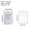 A white photo card album binder with a heart-shaped window and scattered pink confetti.