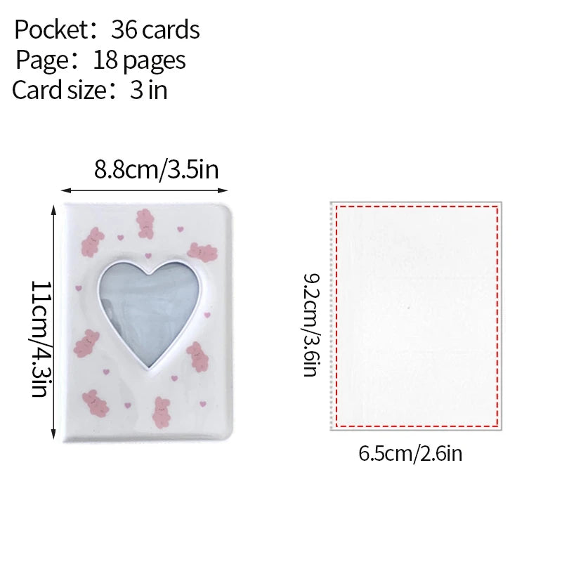 A white photo card album binder with a heart-shaped window and scattered pink confetti.