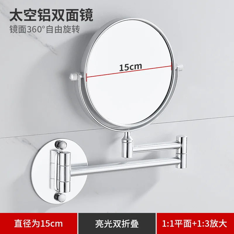 A round silver wall mirror with a 15cm diameter and telescopic arms for folding and mounting.