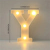 A glowing yellow Y shaped LED letter light decoration for room or party decor.