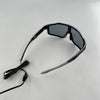 A pair of black wire-frame party glasses with dark lenses and an attached cord.