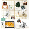 A collection of heavy duty fridge magnetic clips displayed on a gold grid background.