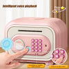 A pink electronic piggy bank with a keypad and fingerprint sensor is shown being operated by a hand.