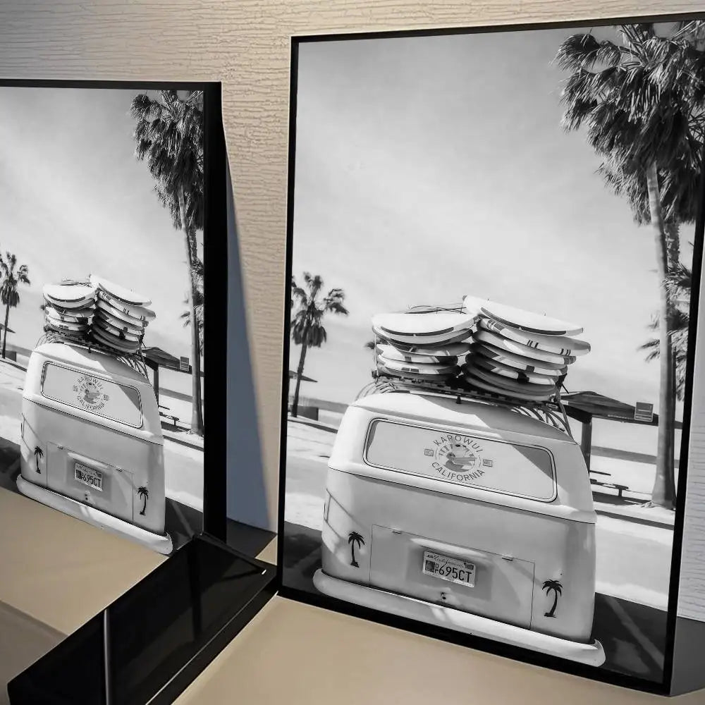 Black and white poster featuring a vintage white van parked near palm trees in a landscape setting.