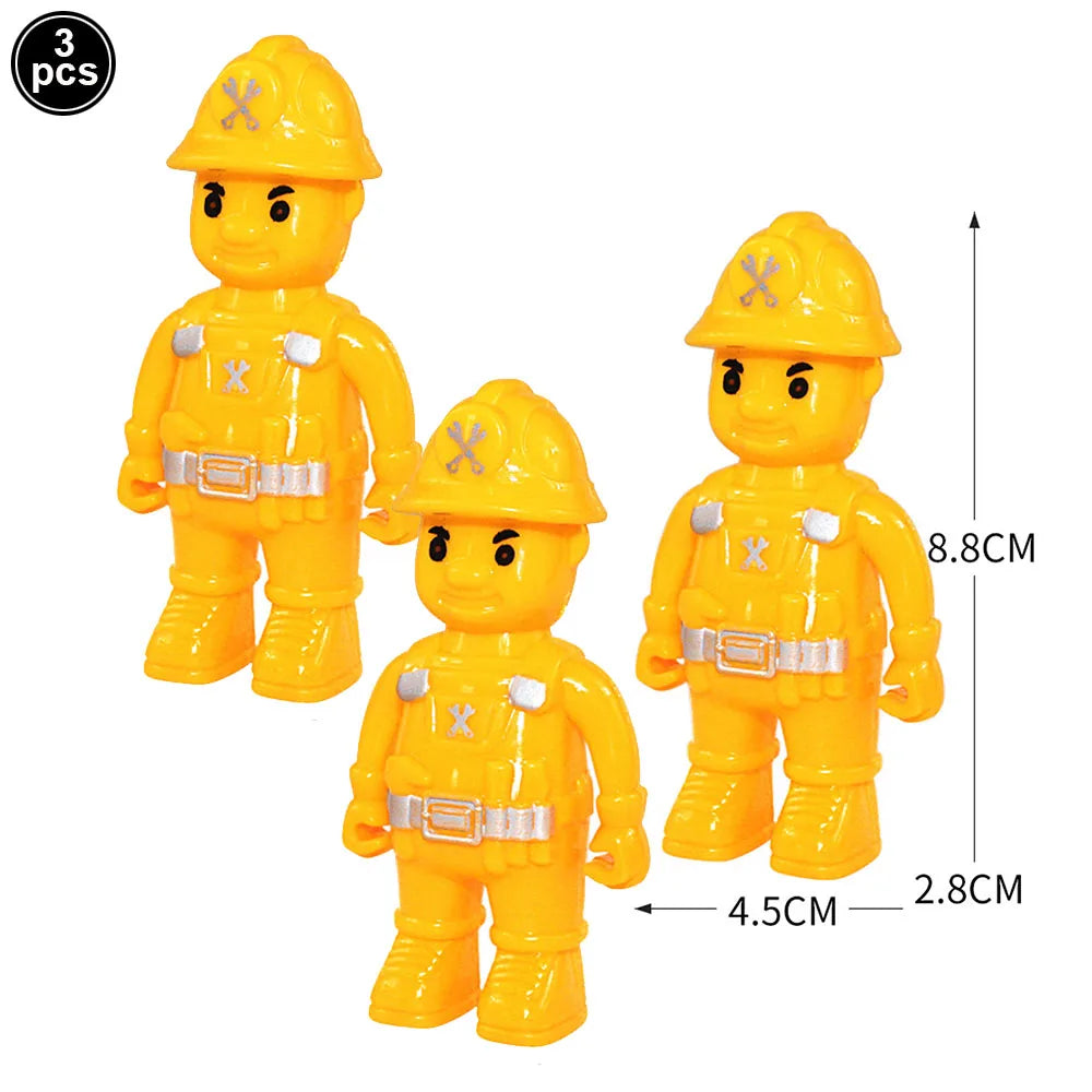 A set of three yellow construction vehicle cake toppers featuring an excavator, crane, and road signs.