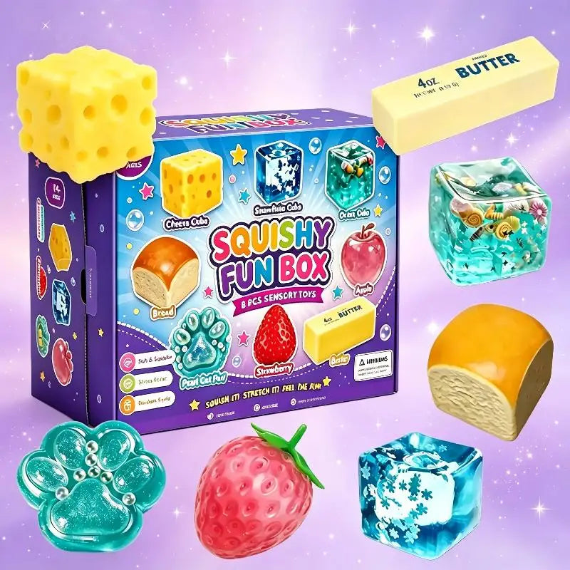 A box of squishy fun box sensory toys including cheese cubes, bread, and strawberry items.