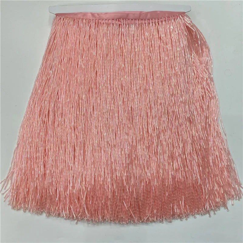 Pink beaded tassel fringe trim used for curtains and DIY projects