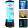 A tall, cylindrical LED fish lamp emits bright blue light and features colorful animated fish.