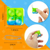 A green mini sensory fidget keychain with a blue accent is shown alongside its chain and a hand for scale.