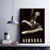 A black poster featuring a vintage boot and microphone design with the word NIRVANA in distressed white text.