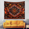 Bohemian sun and moon tapestry wall hanging featuring intricate orange, black, and gold patterns.