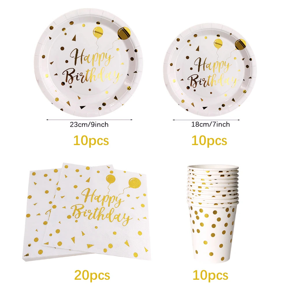 Un juego de vajilla desechable para fiestas con lunares dorados, incluyendo platos, servilletas y vasos.
