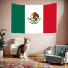 A decorative banner featuring the flag of Mexico, green, white, and red, displayed on a wall.