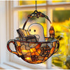 Halloween ghost reading book window hanging decoration featuring a white ghost character inside a glass cauldron