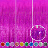A vibrant purple metallic foil tinsel fringe backdrop set with various colored strips.