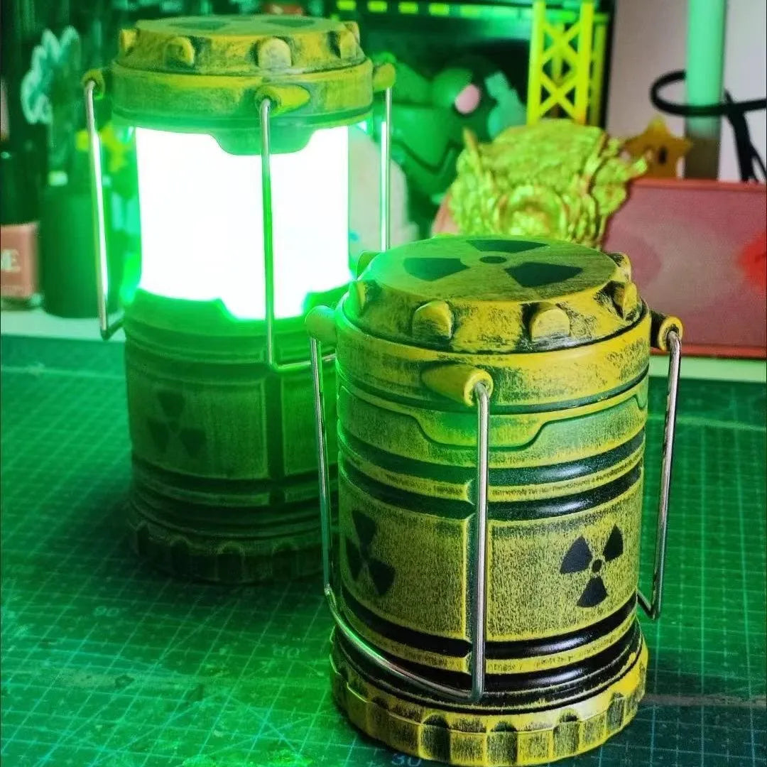 A yellow mini nuclear reactor lantern emitting an eerie green glow, set on a green surface.