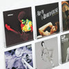 A collection of clear acrylic floating record shelves displaying various vinyl albums.