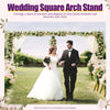 A bride and groom stand under a floral wedding arch stand outdoors in a garden setting.