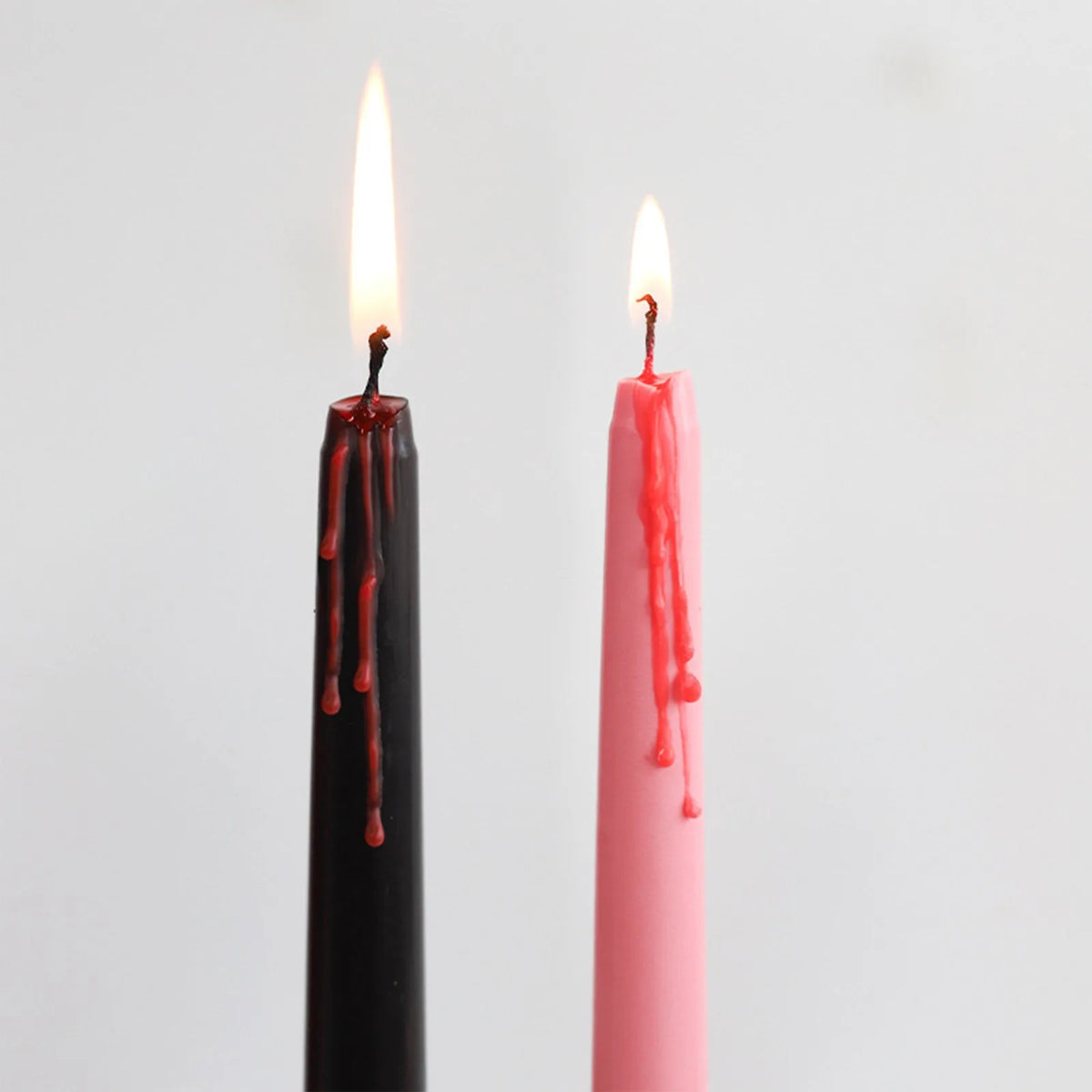 A set of four gothic vampire tears taper candles with a dripping blood effect.