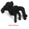 A black plush spider decoration with red eyes, measuring 30cm or 11.81 inches.