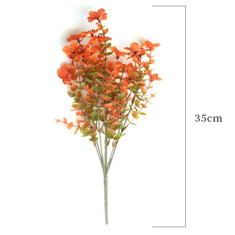 A bouquet of orange and reddish-orange artificial daisies for autumn home decor.