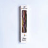 A vertical product shot of Rainbow Candle birthday candles in a box, showing various colored metallic strands.