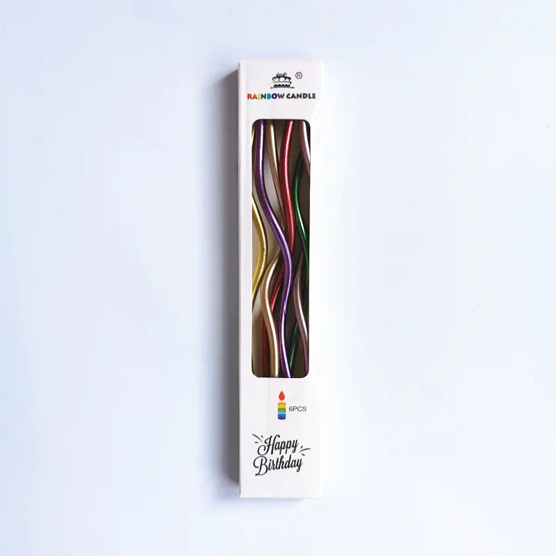 A vertical product shot of Rainbow Candle birthday candles in a box, showing various colored metallic strands.