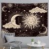 A dark tapestry wall hanging featuring a celestial design with a crescent moon and a sun surrounded by stars and clouds.
