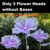 Three large purple velvet mesh flower heads without bases displayed against green foliage.