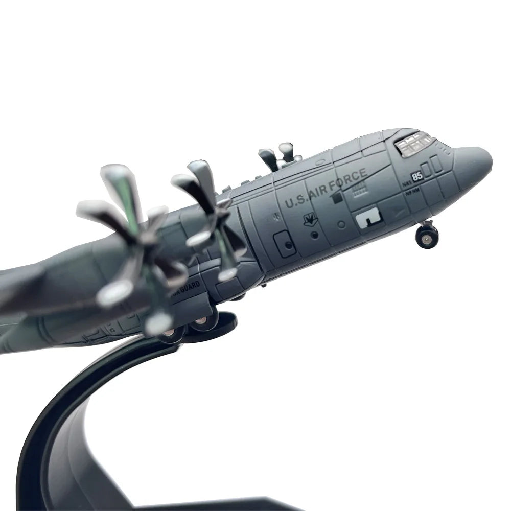 A detailed diecast model of a U.S. Air Force C-130 Hercules aircraft in gray.